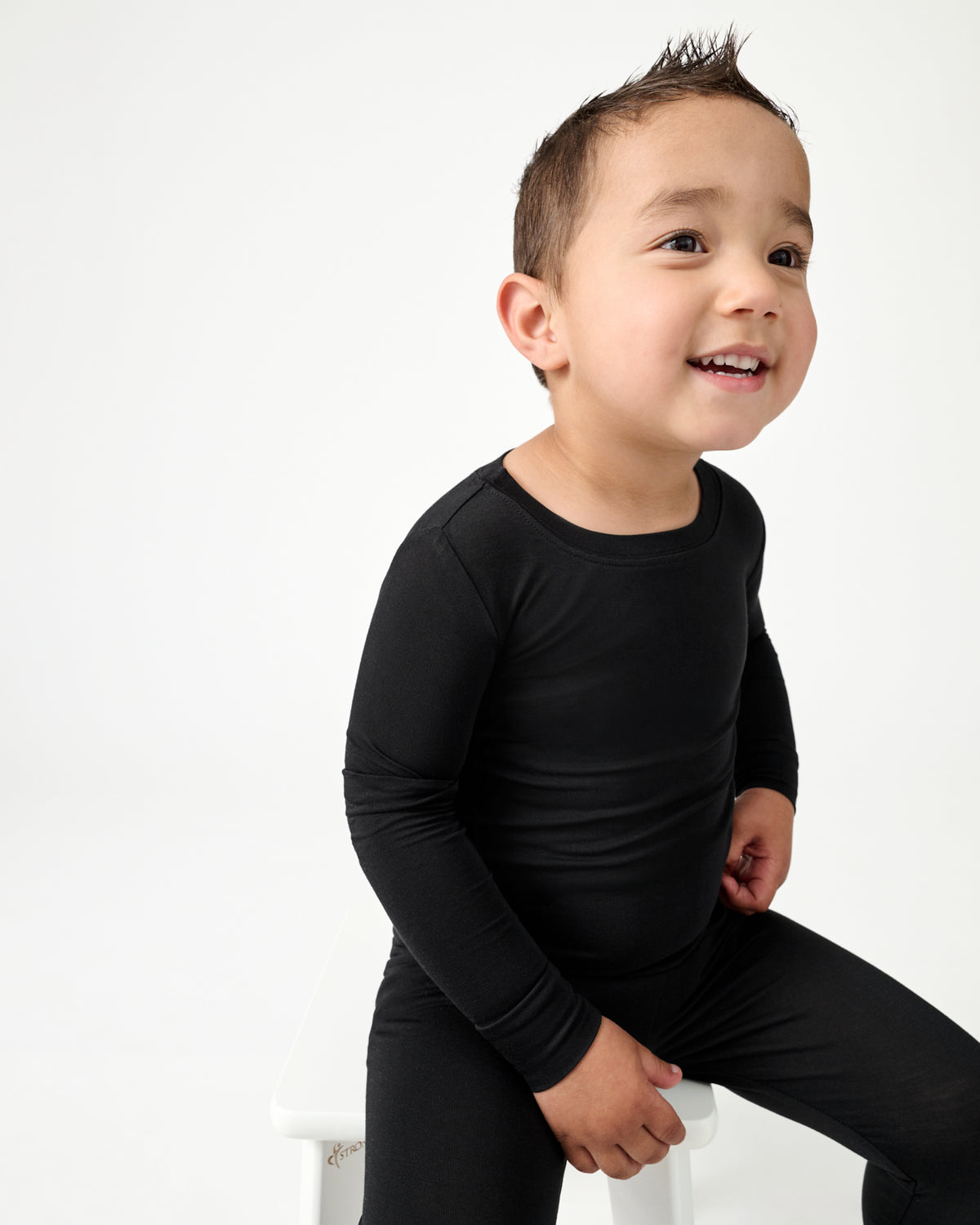 Close up of boy wearing the Black Two-Piece Pajama Set