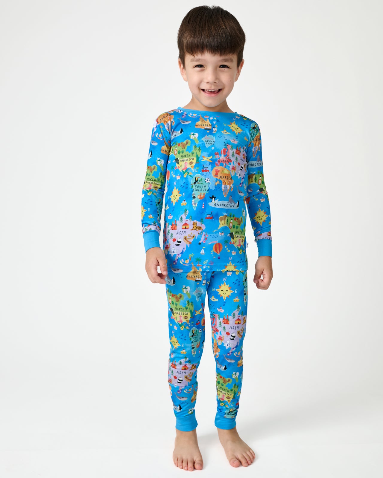 Standing boy wearing the Around The World Two-Piece Pajama Set