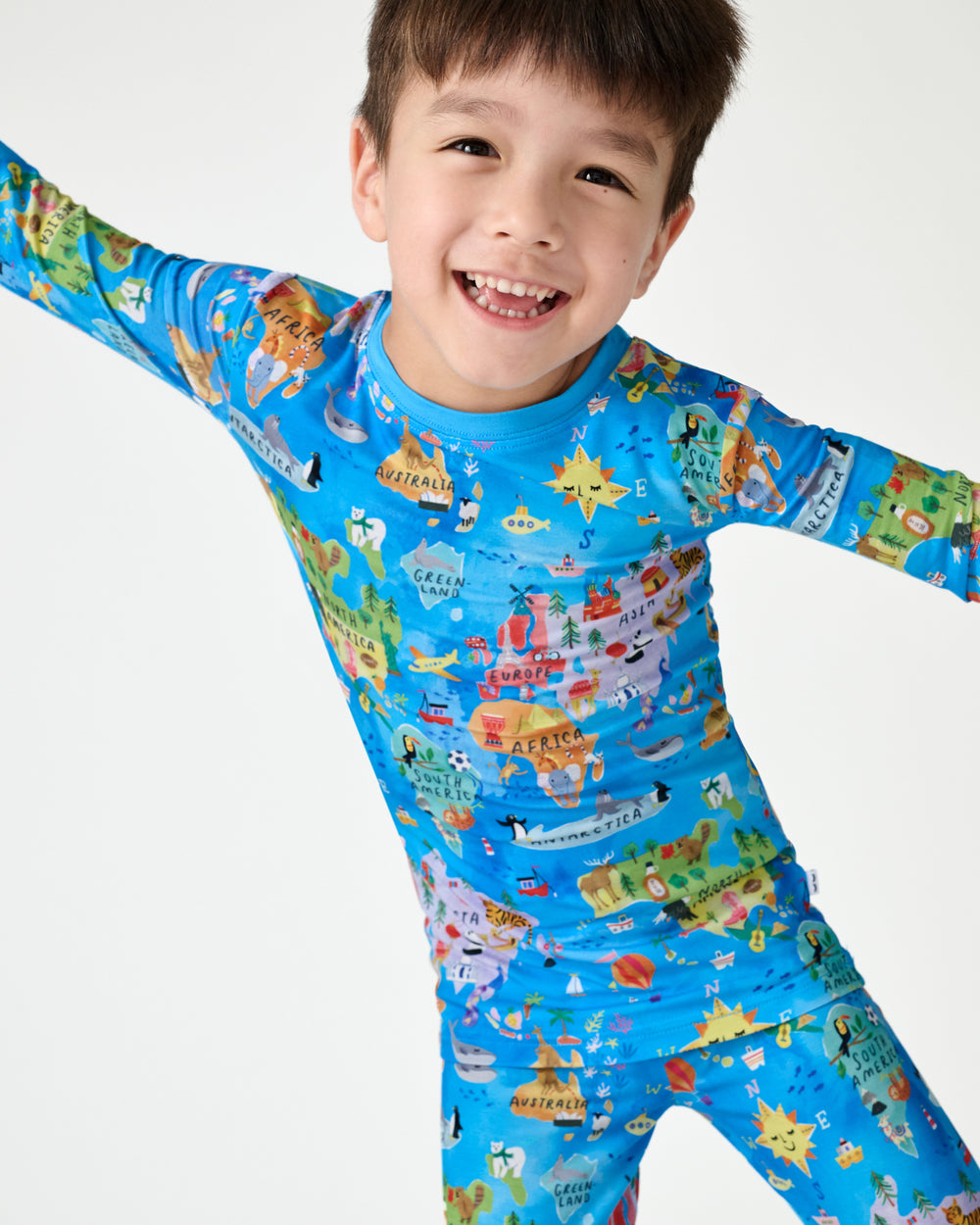 Close up of boy wearing the Around The World Two-Piece Pajama Set