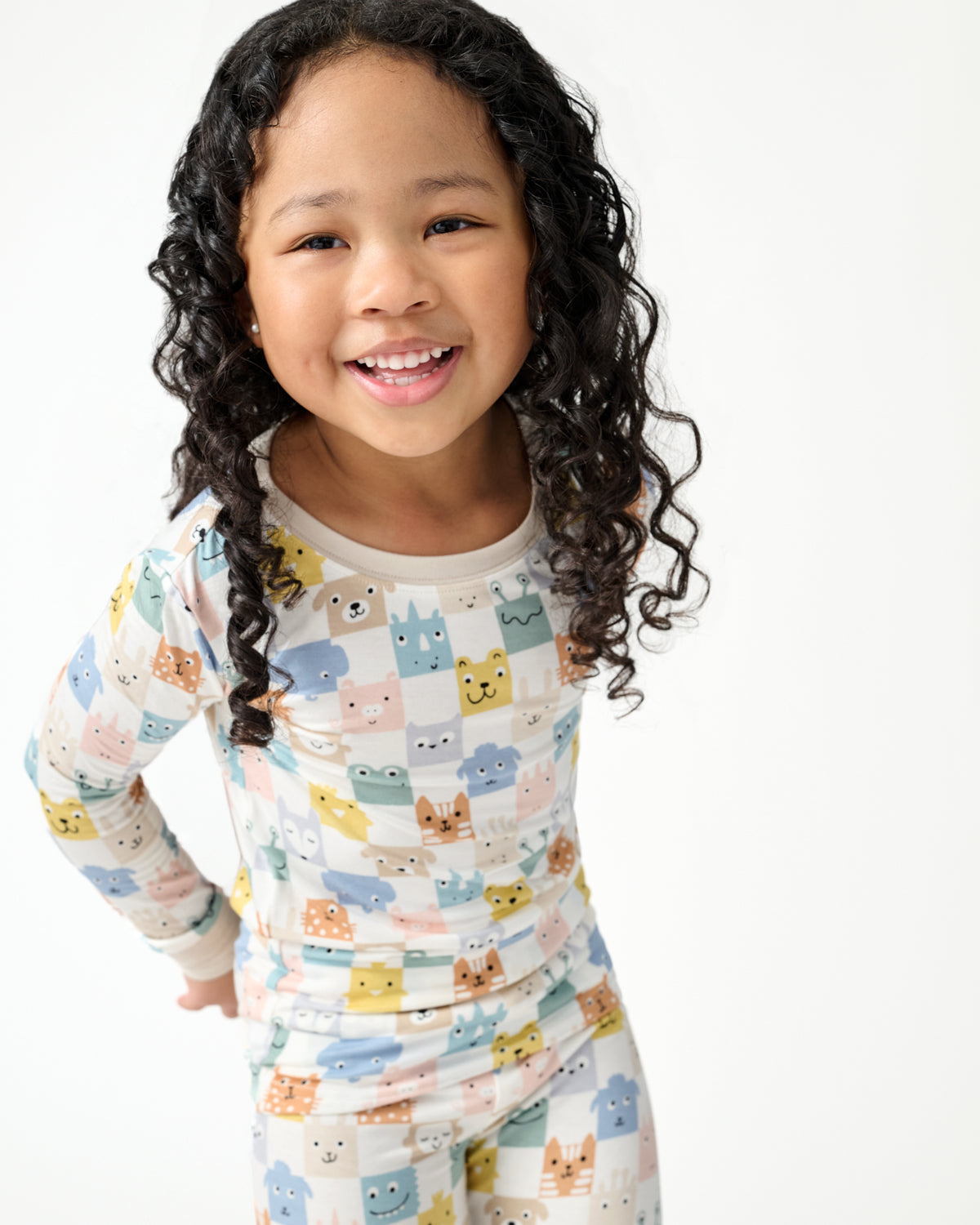 Close up of girl wearing the Check Mates Two-Piece Pajama Set