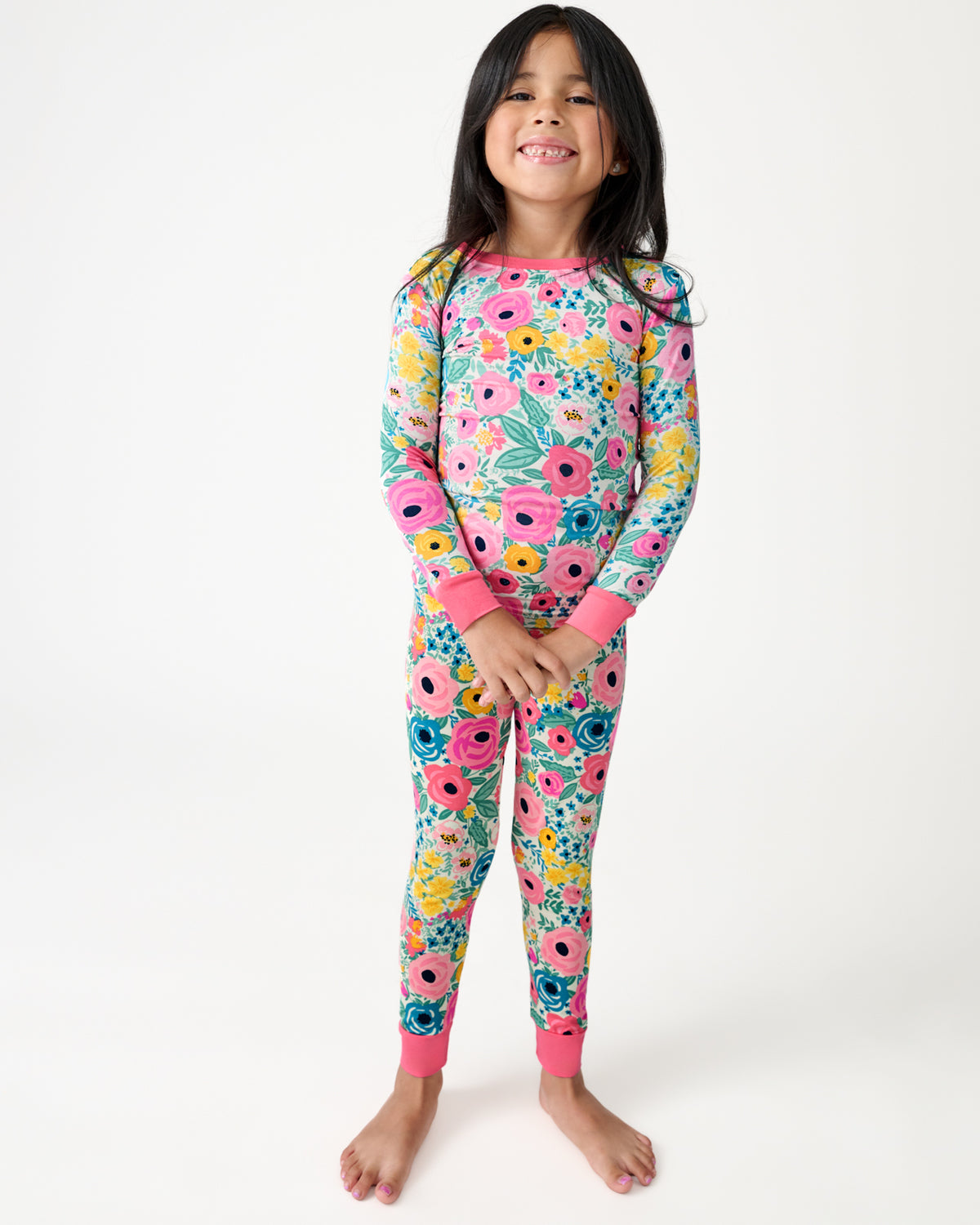 Standing girl wearing the Secret Garden Two-Piece Pajama Set