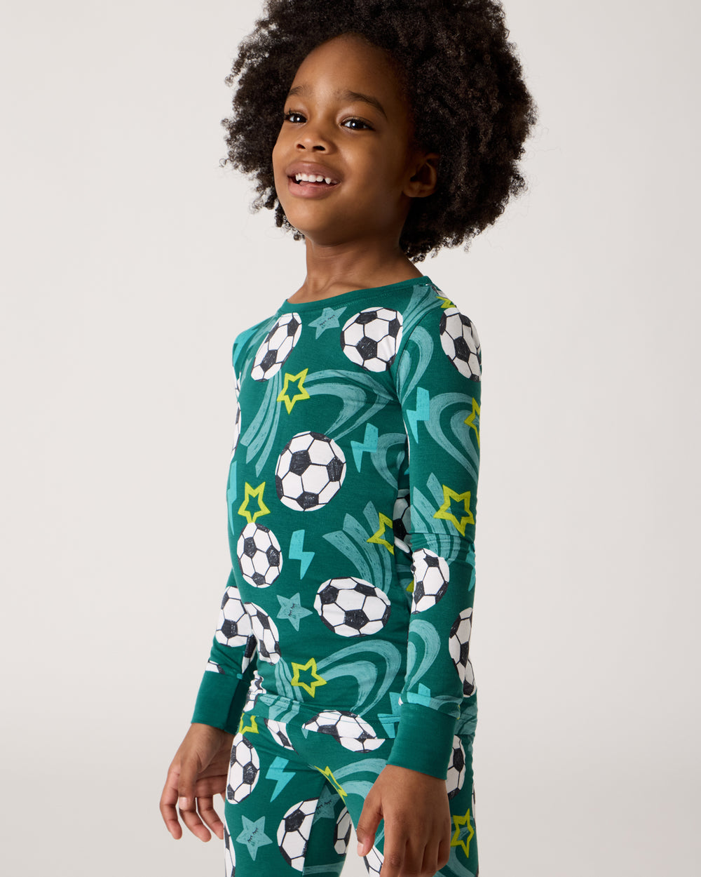 Close up of boy wearing the Soccer Stars Two-Piece Pajama Set