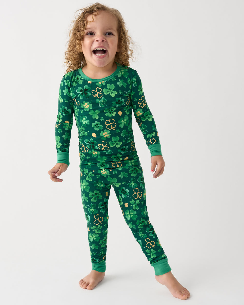 Standing girl wearing the Clover Cuties Two-Piece Pajama Set