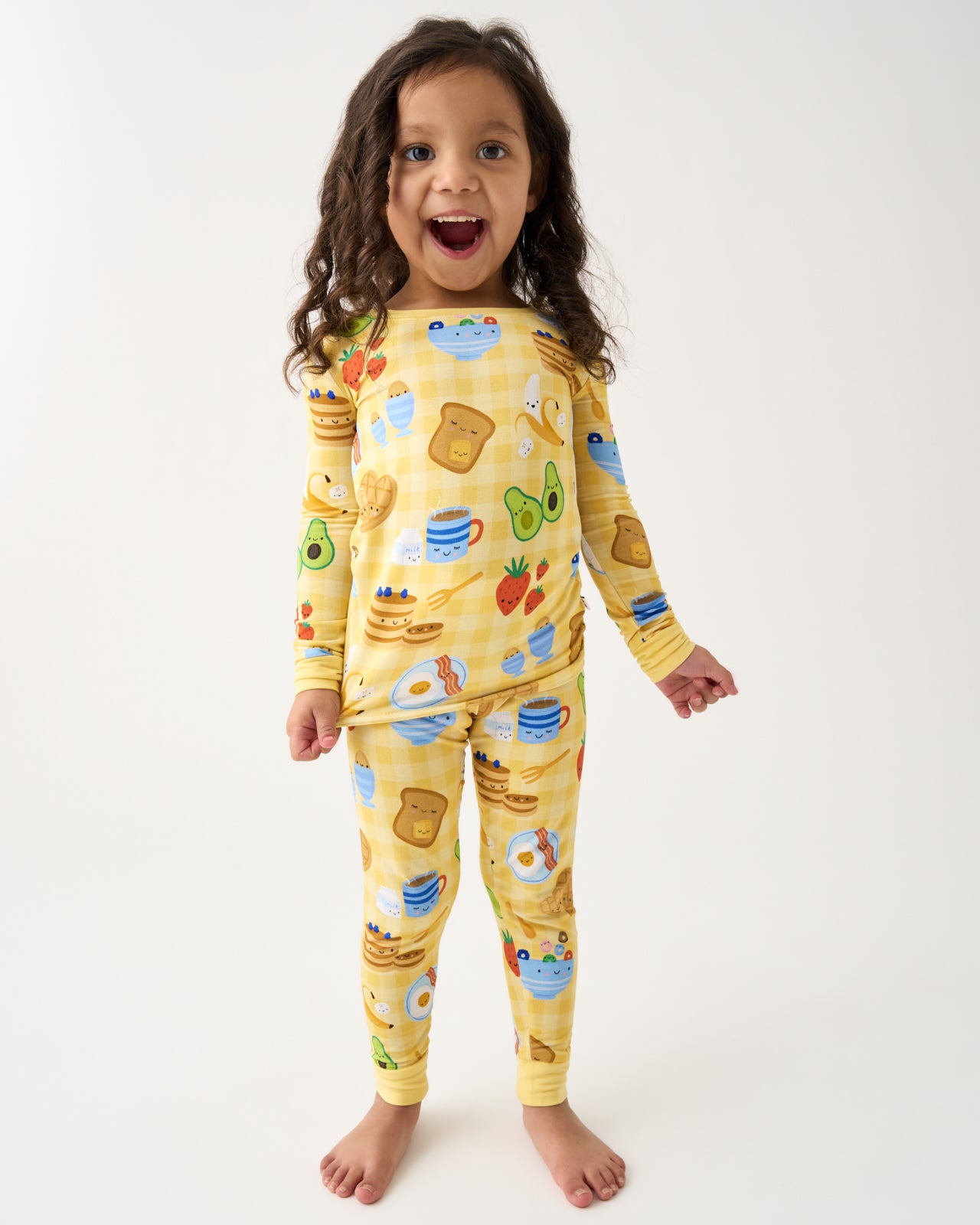 Standing girl wearing the Breakfast Bunch Two-Piece Pajama Set