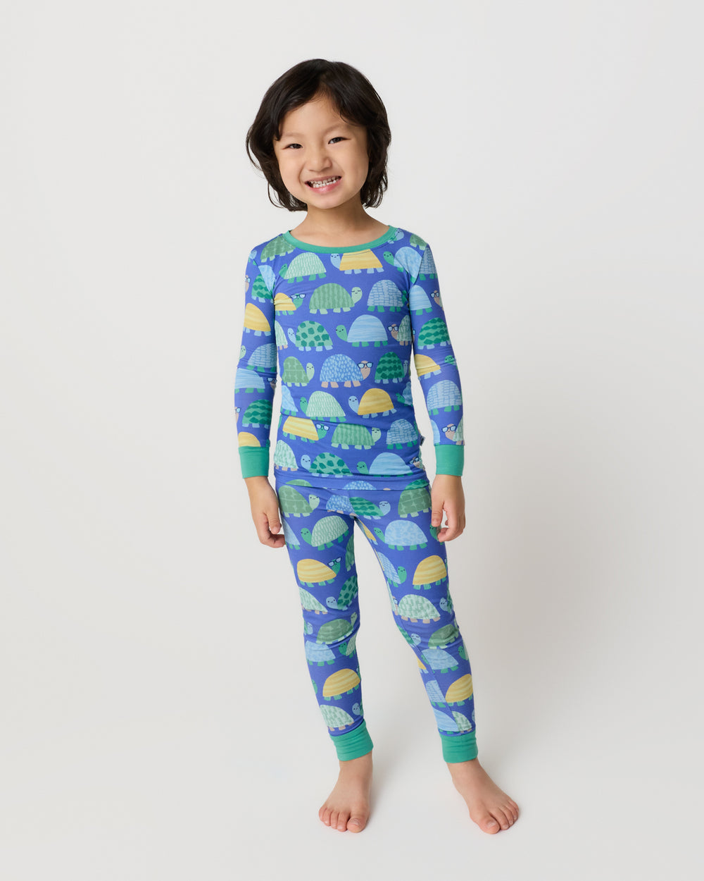 Standing child wearing the Shell Parade Two-Piece Pajama Set