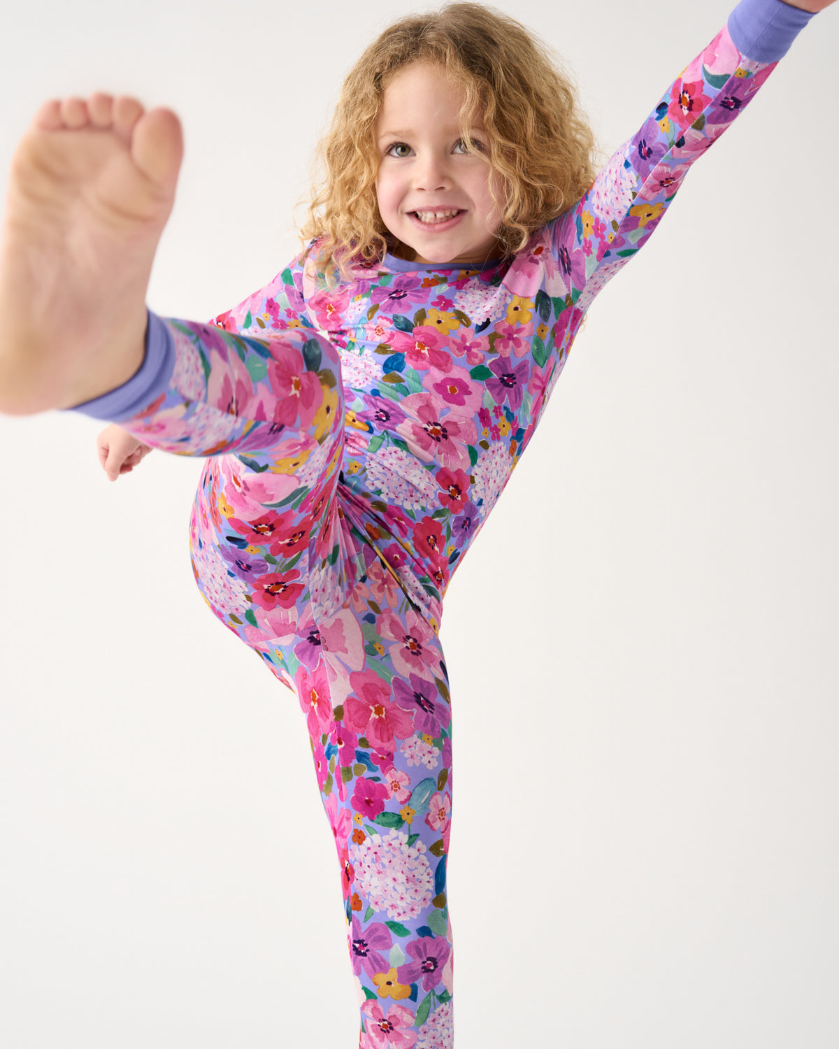 Posing child wearing the Sweet Sprigs Two-Piece Pajama Set