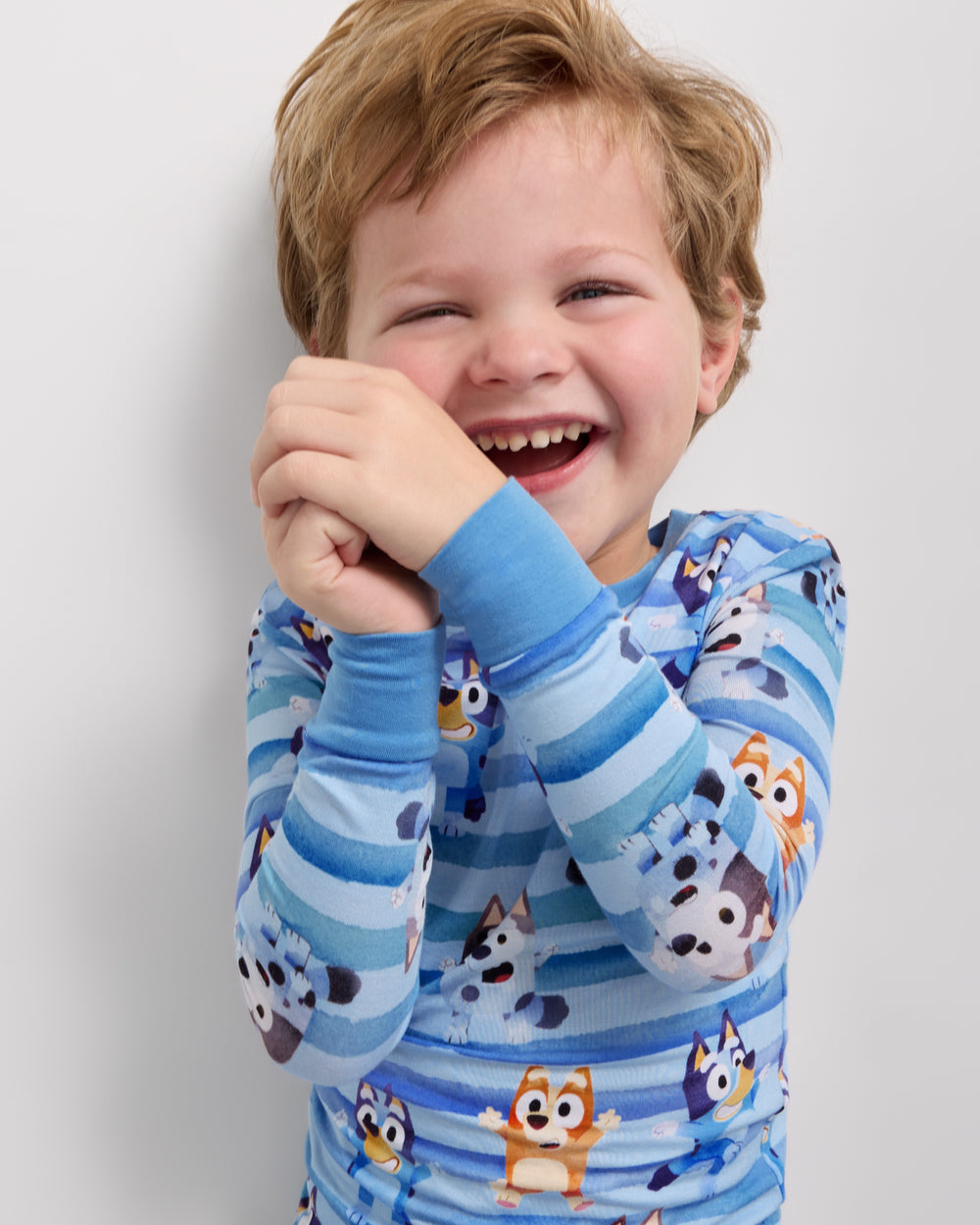 Close up of boy wearing the Bluey Dance All Day Two-Piece Pajama Set