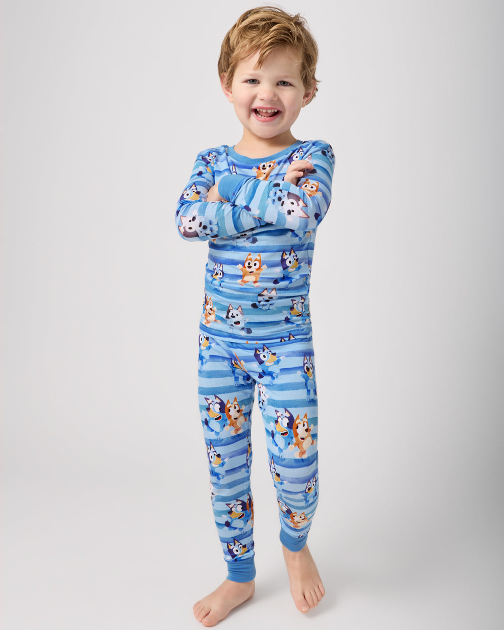 Standing boy wearing the Bluey Dance All Day Two-Piece Pajama Set