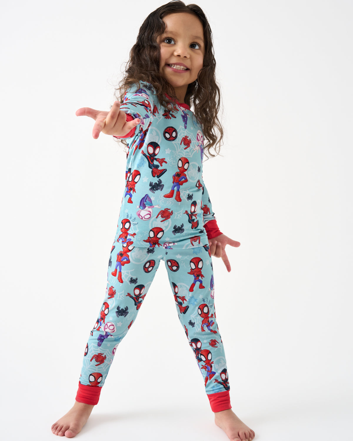 Posing girl wearing the Spidey & Friends Tiny Webs Two-Piece Pajama Set