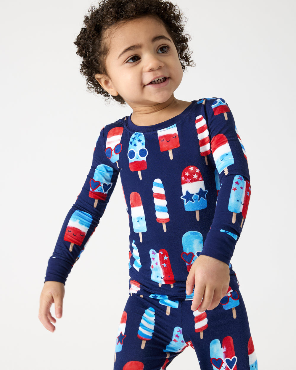 Close up of boy wearing the Sparkle Treats Two-Piece Pajama Set