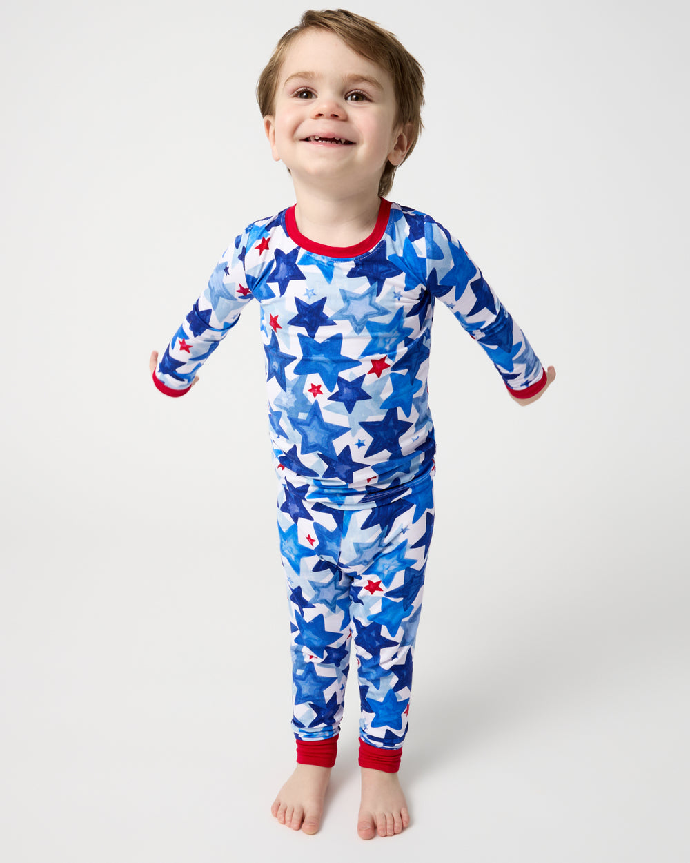 Boy wearing the Starry Splash Two-Piece Pajama Set