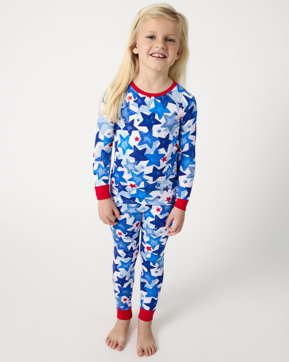 Standing girl wearing the Starry Splash Two-Piece Pajama Set