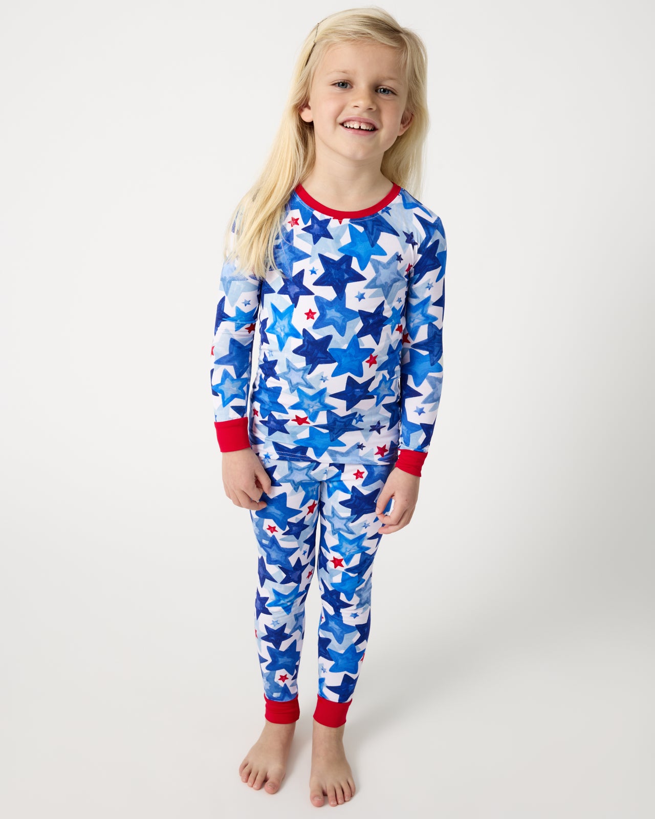 Standing girl wearing the Starry Splash Two-Piece Pajama Set