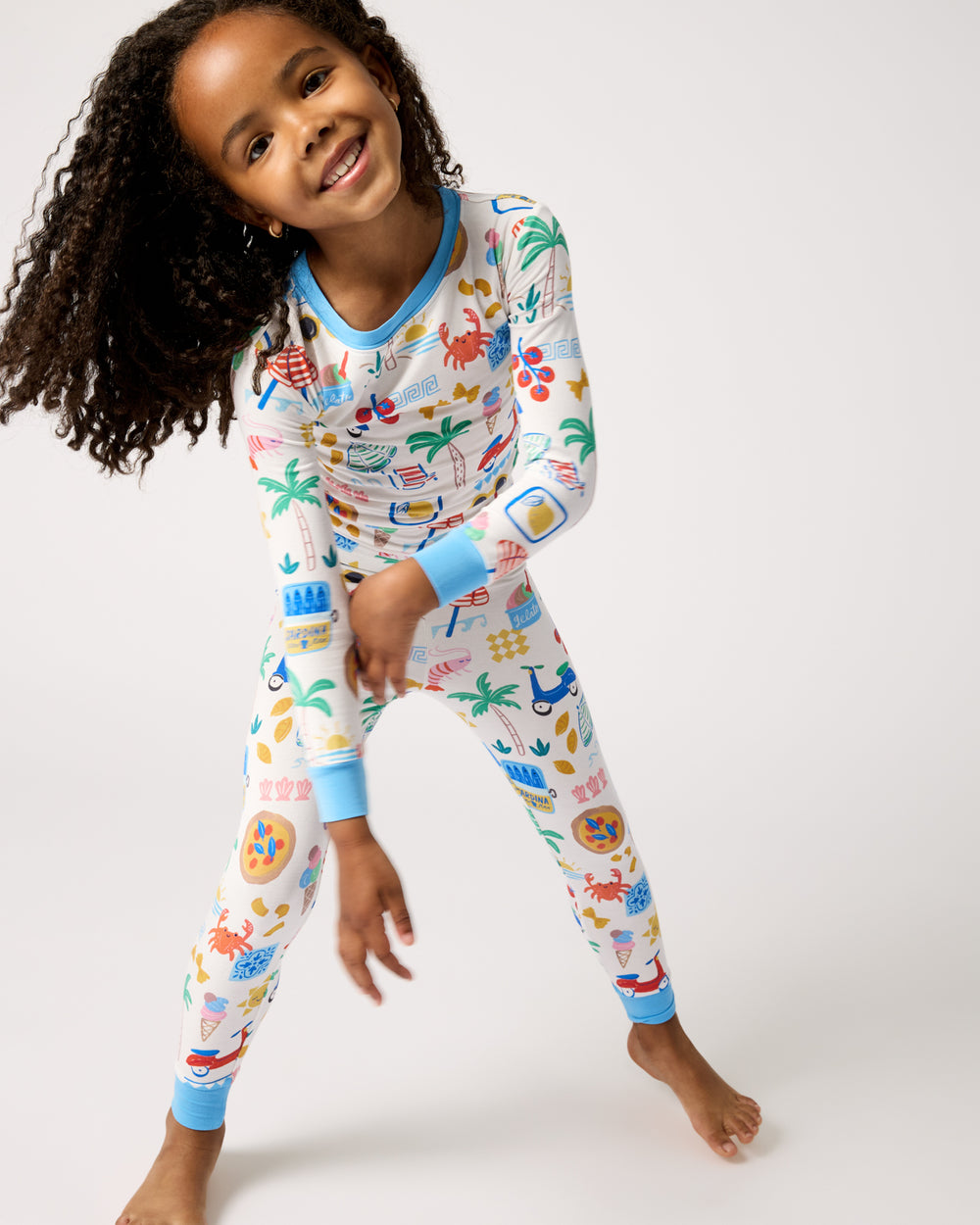 Standing girl wearing the Ciao Bella Two-Piece Pajama Set