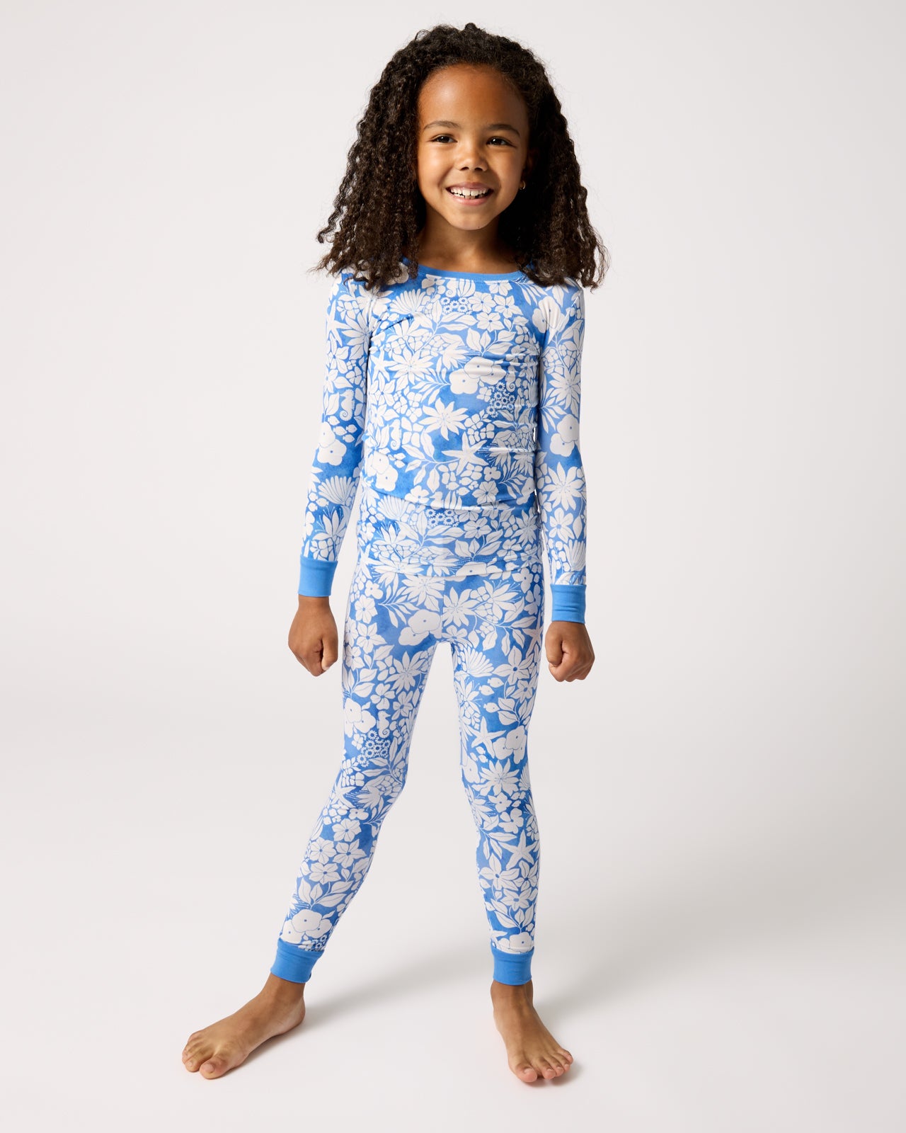 Standing girl wearing the Azure Garden Two-Piece Pajama Set