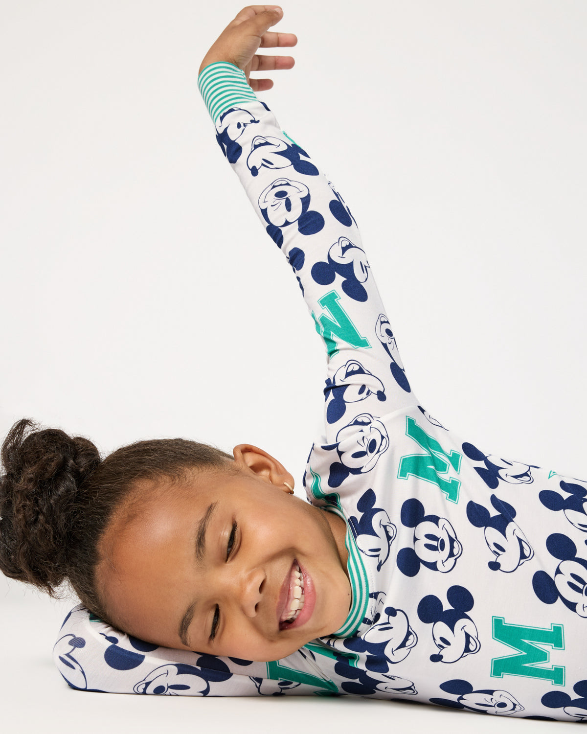 Close up of girl wearing the Disney Varsity Mickey Mouse Two-Piece Pajama Set