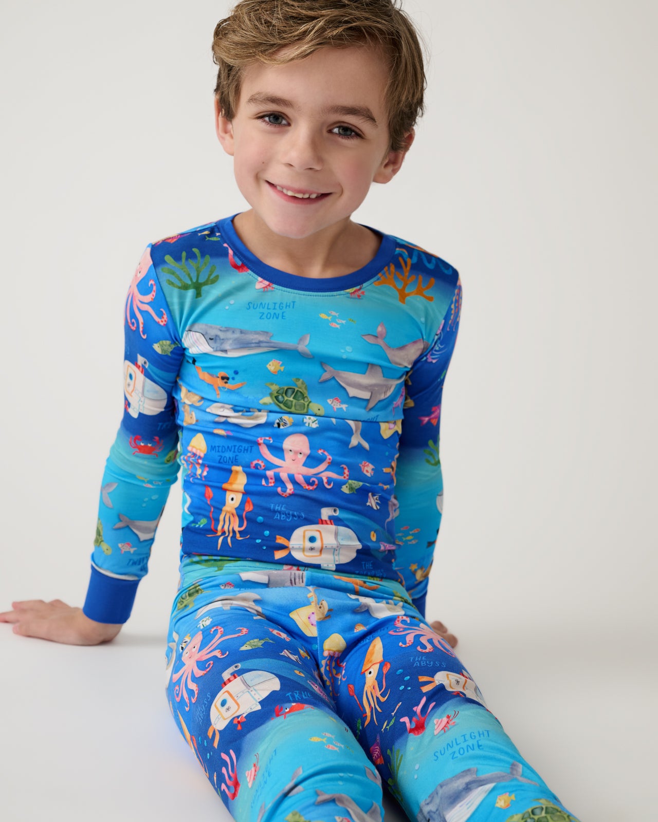 Alternate of sitting boy wearing the Underwater Discovery Two-Piece Pajama Set