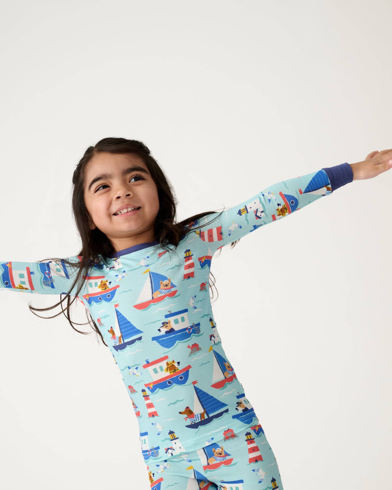Close up of girl wearing the Nautical Paws Two-Piece Pajama Set