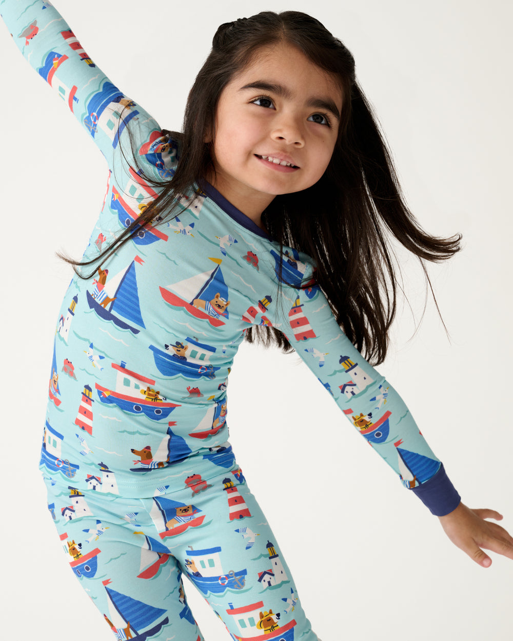 Posing girl wearing the Nautical Paws Two-Piece Pajama Set