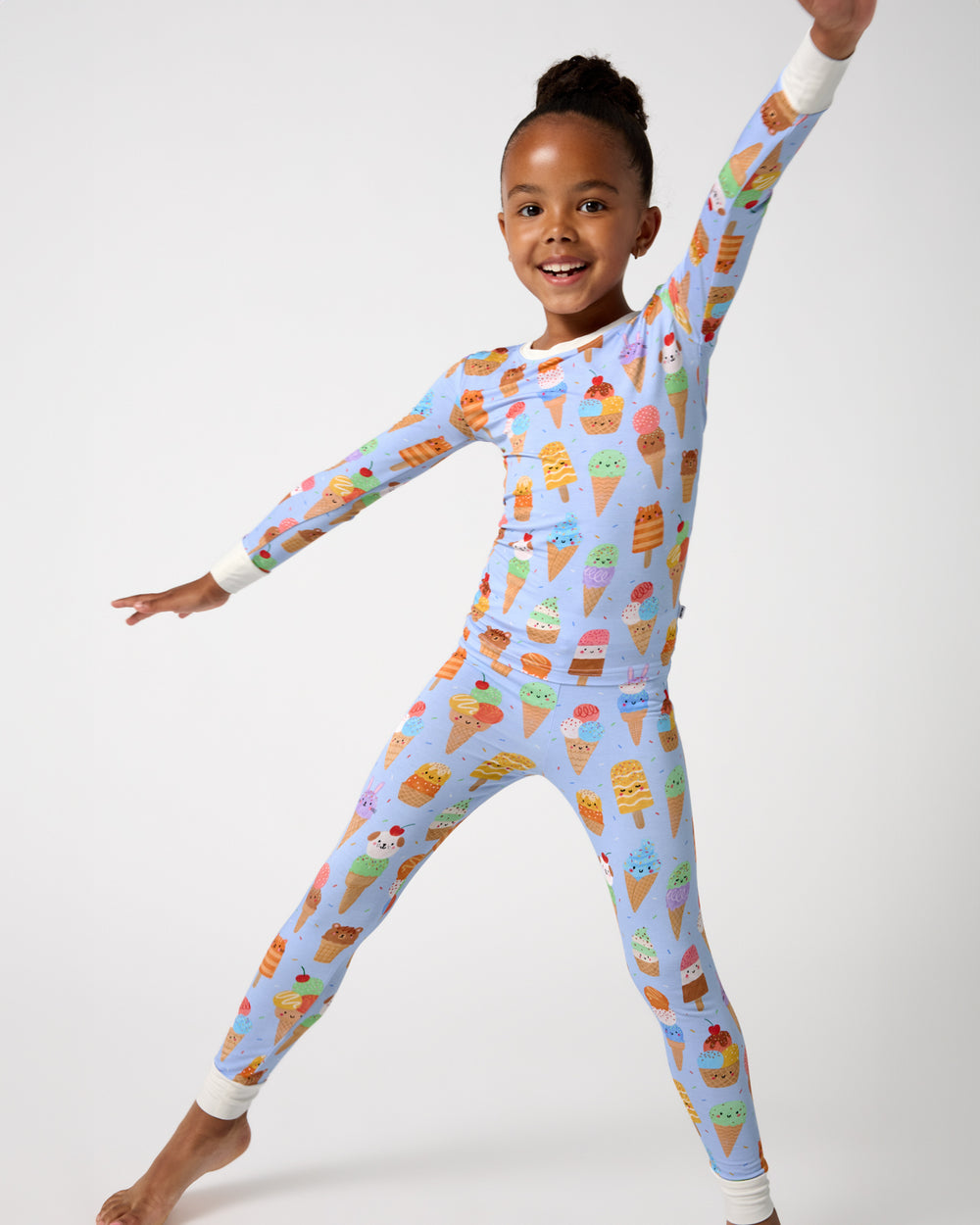 Posing girl wearing the Scoop Squad Two-Piece Pajama Set