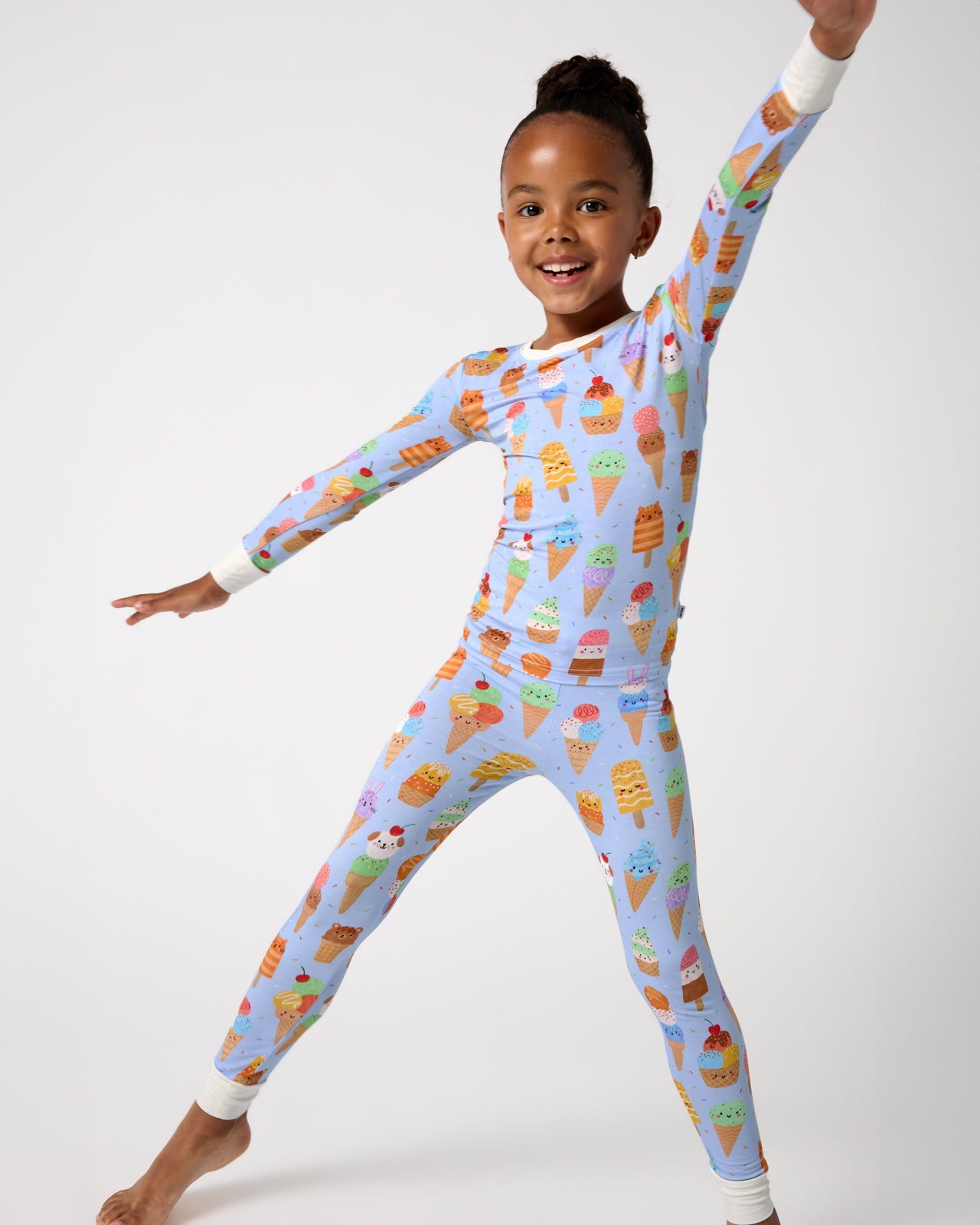 Posing girl wearing the Scoop Squad Two-Piece Pajama Set