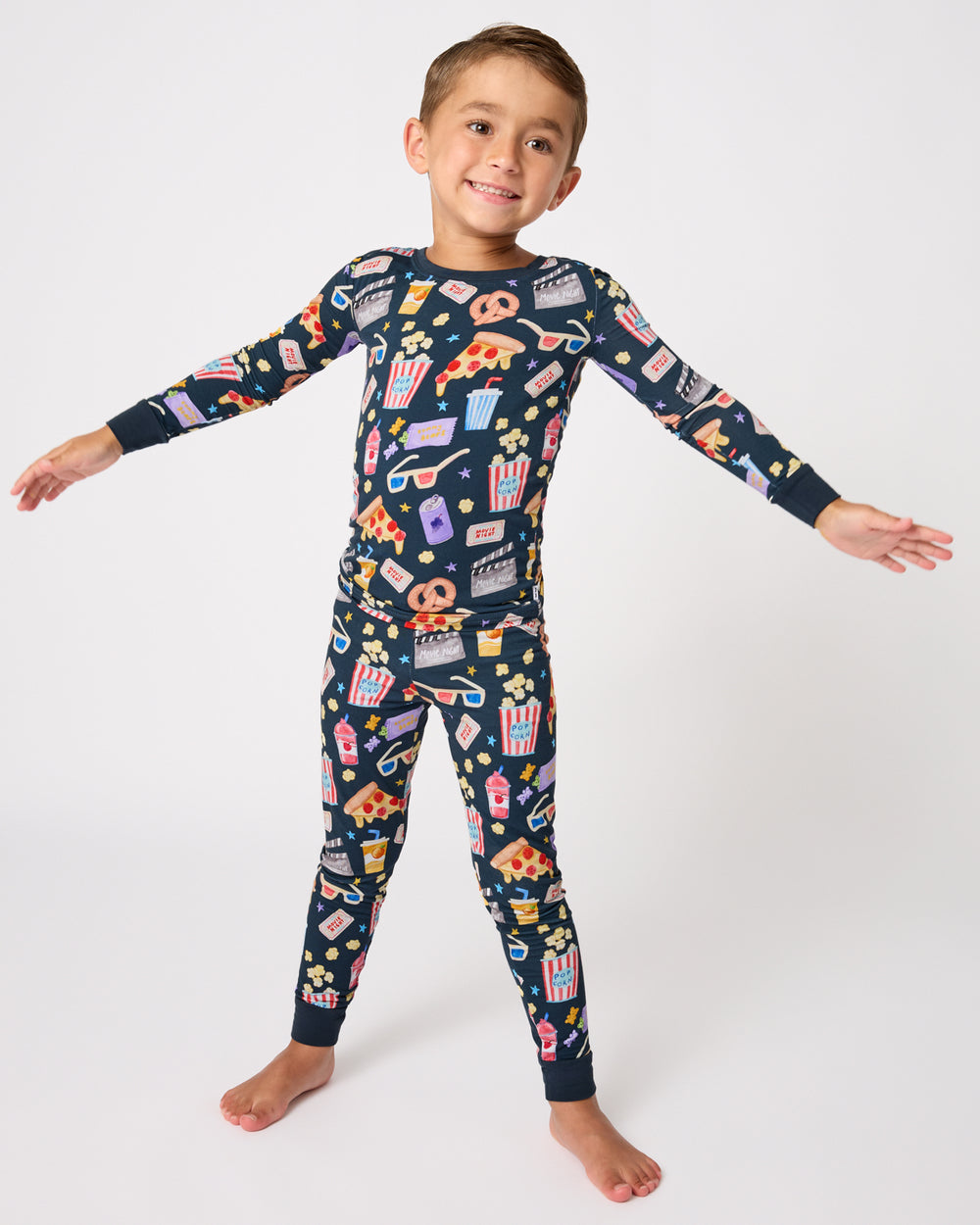 Standing child wearing the Movie Marathon Two-Piece Pajama Set