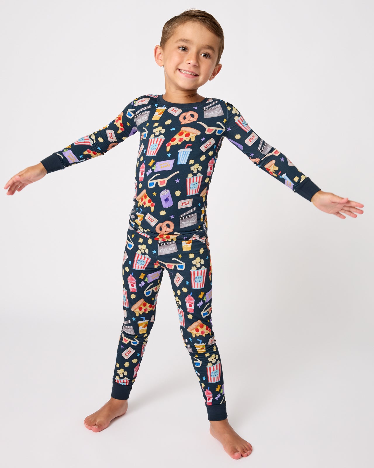 Standing child wearing the Movie Marathon Two-Piece Pajama Set