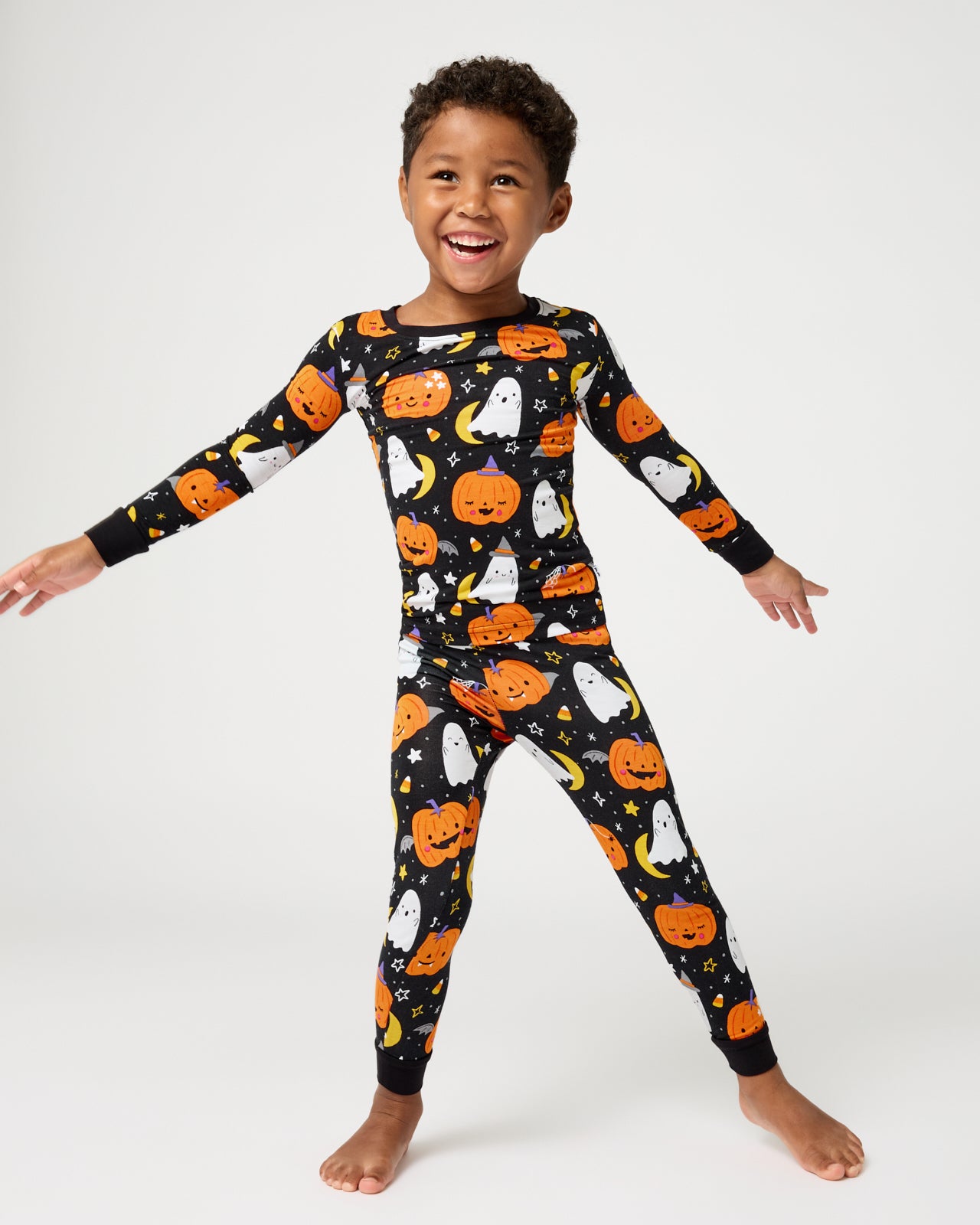 Standing child wearing the Moonlit Magic Two-Piece Pajama Set