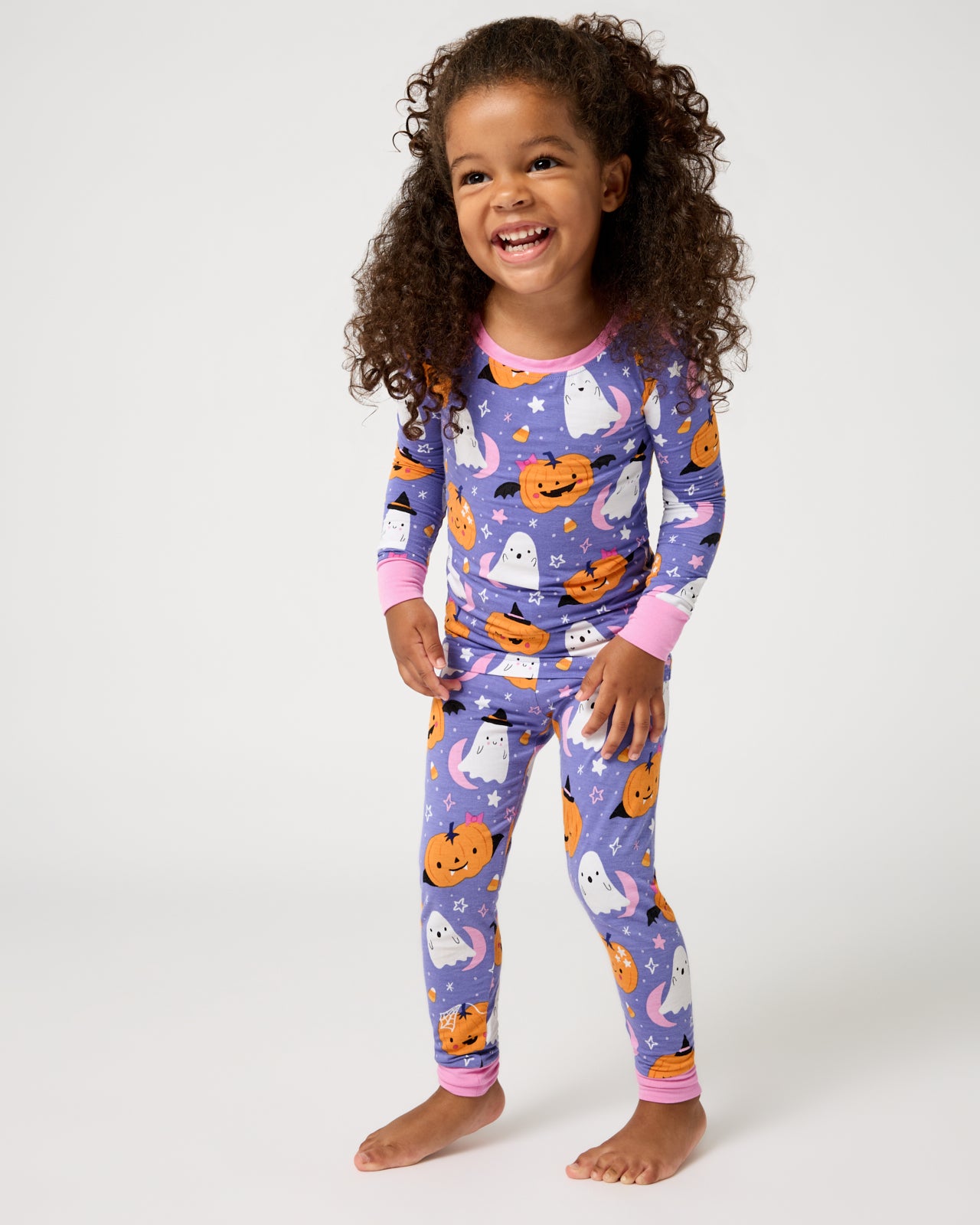 Standing girl wearing the Moonlit Magic Purple Two-Piece Pajama Set