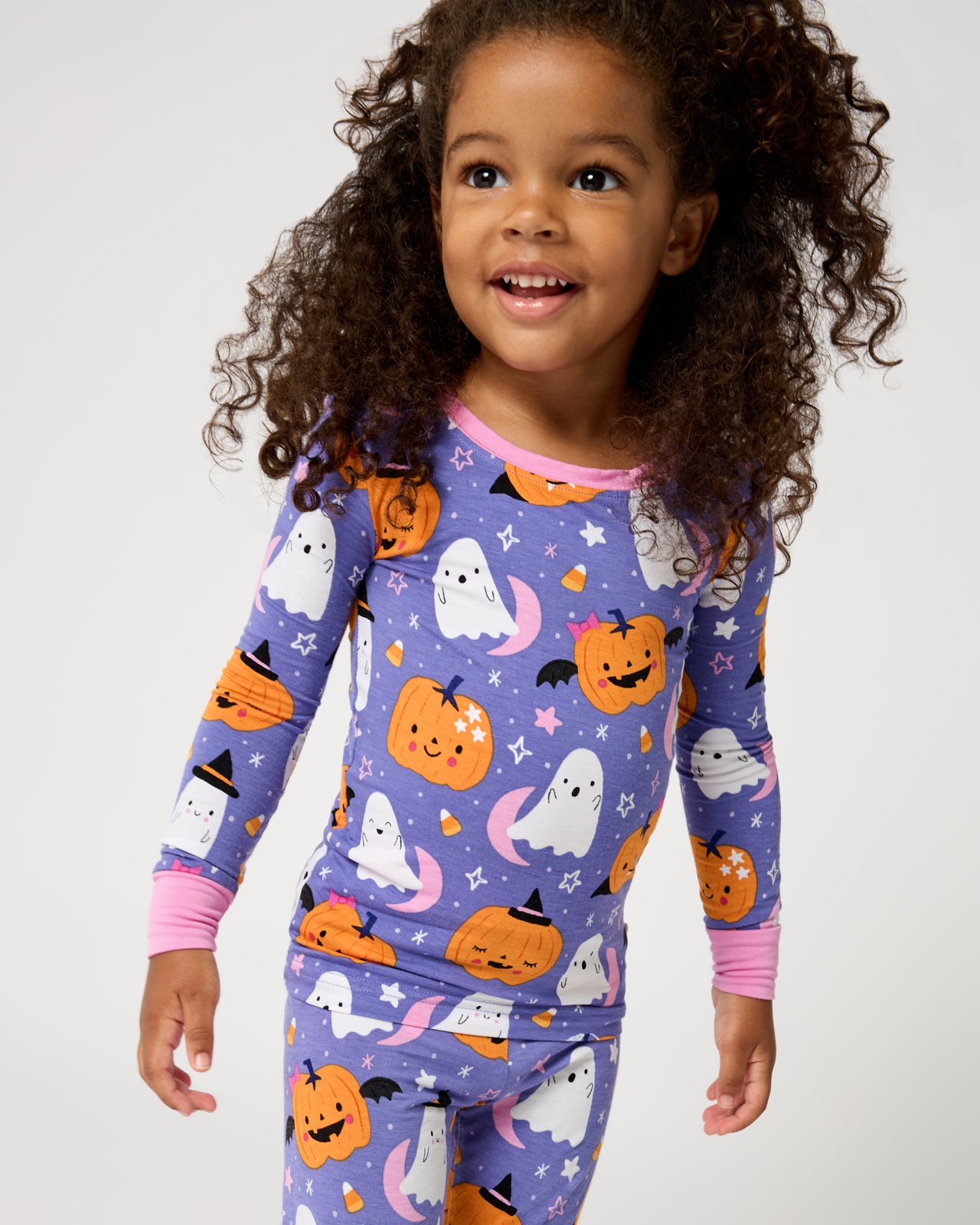 Close up of girl wearing the Moonlit Magic Purple Two-Piece Pajama Set