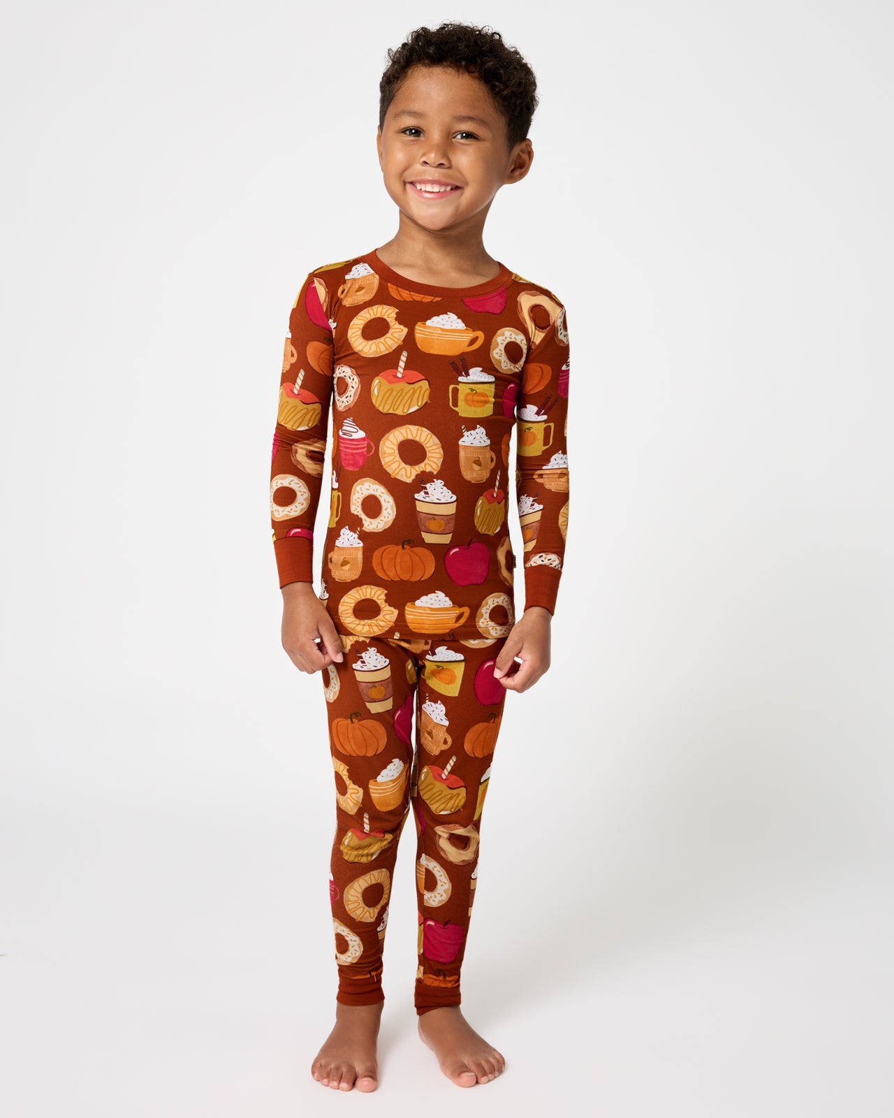 Standing boy wearing the Harvest Sweets Two-Piece Pajama Set