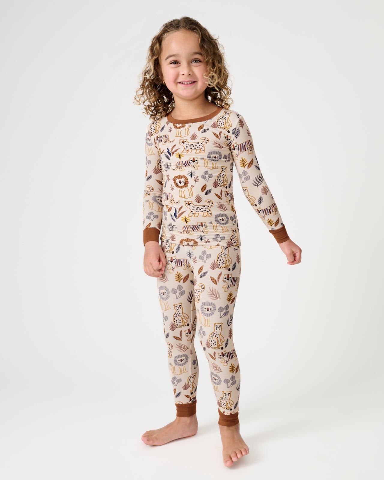 Standing girl wearing the Savanna Friends Two-Piece Pajama Set