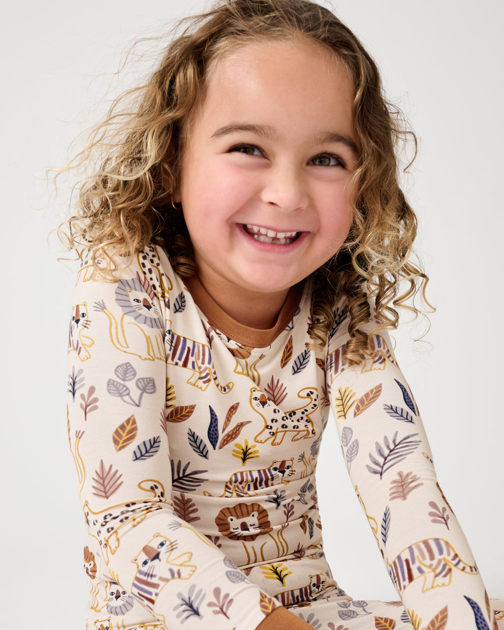 Close up of girl wearing the Savanna Friends Two-Piece Pajama Set