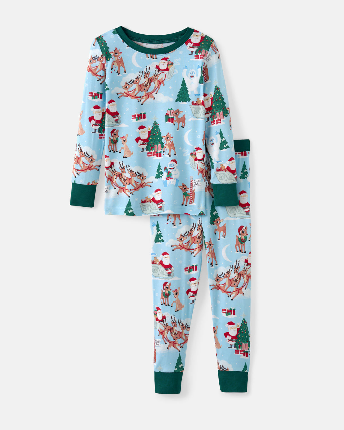 A two-piece children's pajama set featuring a light blue Christmas print with Santa Claus, reindeer, and Christmas trees, complete with dark green cuffs and leg cuffs, shown on a light gray background.