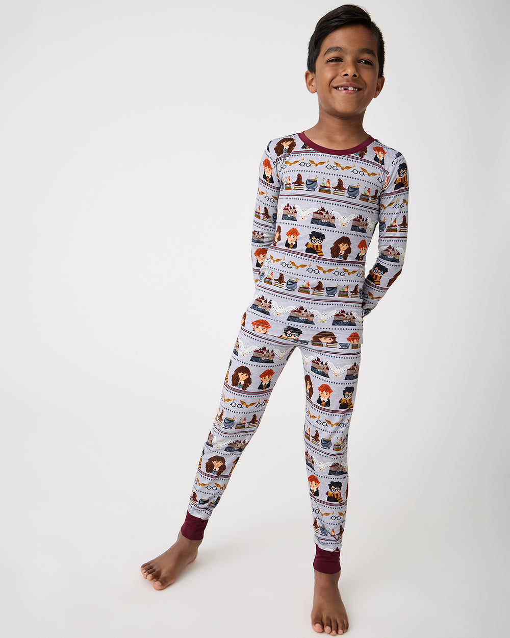Standing boy wearing the Harry Potter™ Spellbinding Studies Two-Piece Pajama Set