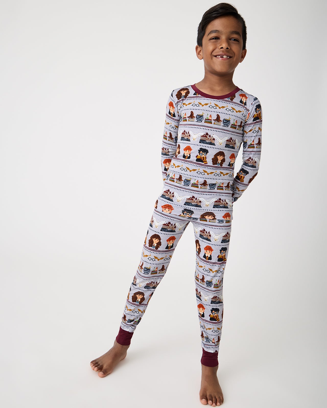 Standing boy wearing the Harry Potter™ Spellbinding Studies Two-Piece Pajama Set