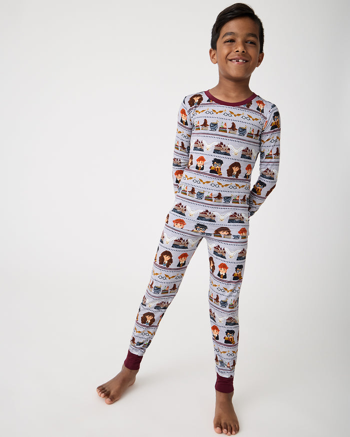 Standing boy wearing the Harry Potter™ Spellbinding Studies Two-Piece Pajama Set