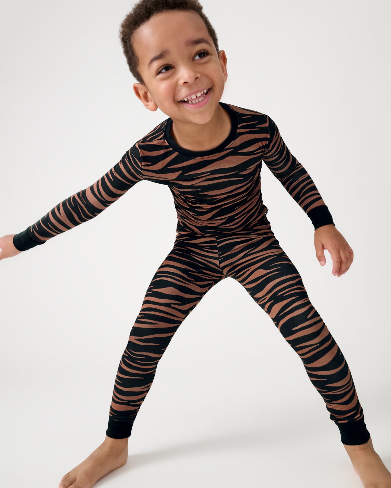 Boy wearing the Wild Stripes Two-Piece Pajama Set