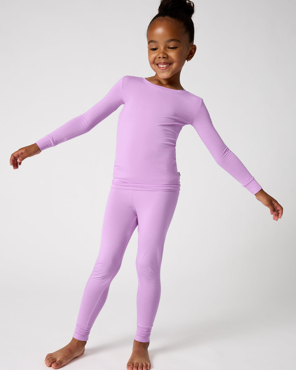 Standing girl wearing the Soft Wisteria Two-Piece Pajama Set