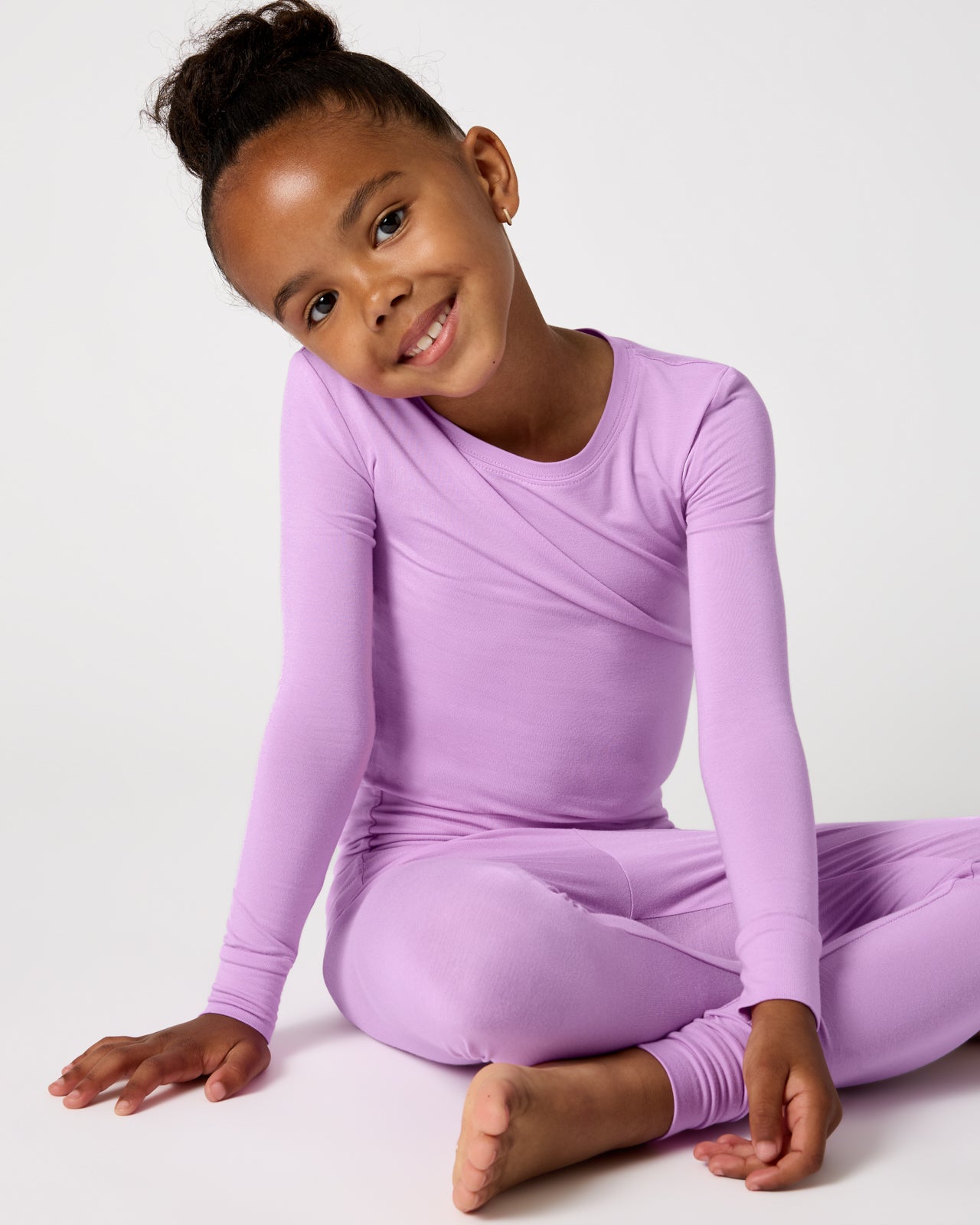 Sitting child wearing the Soft Wisteria Two-Piece Pajama Set