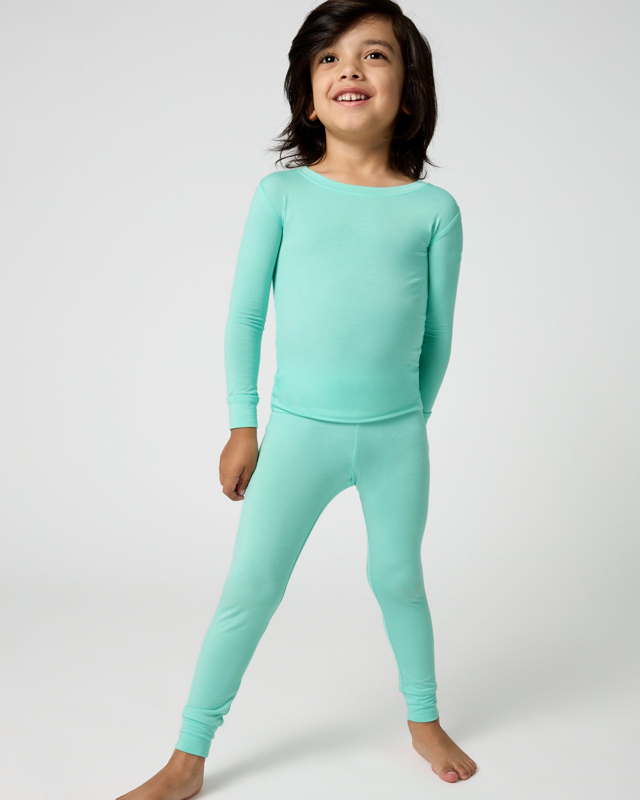 Standing boy wearing the Ocean Mist Two-Piece Pajama Set