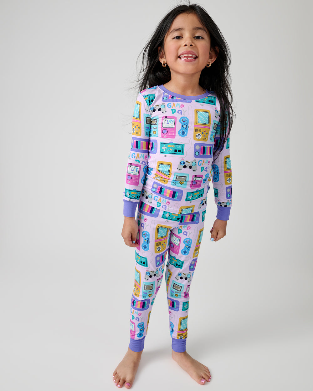 Standing girl wearing the Purple Game On Two-Piece Pajama Set