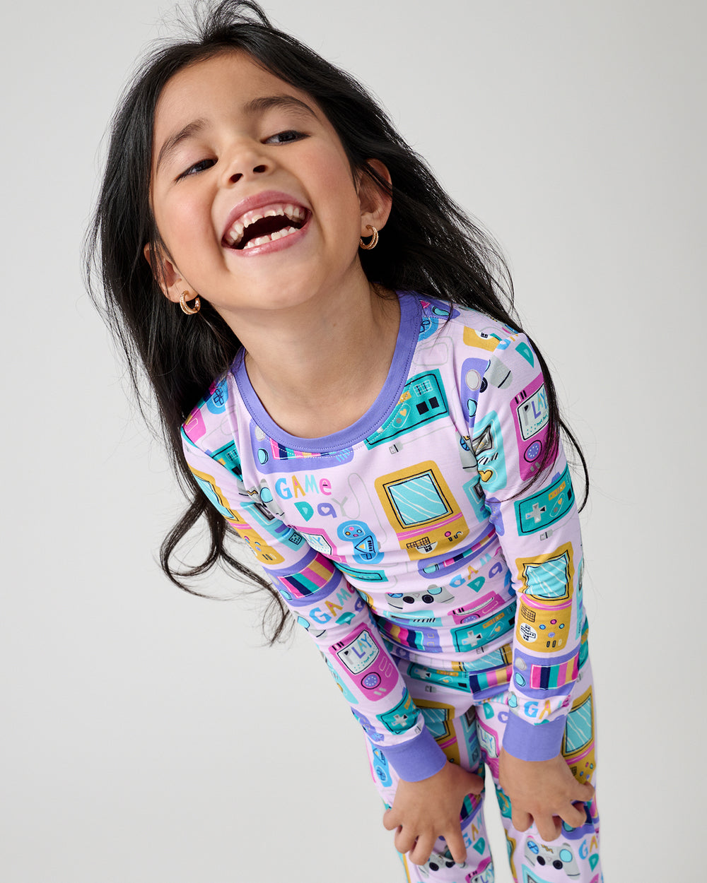 Close up of girl wearing the Purple Game On Two-Piece Pajama Set