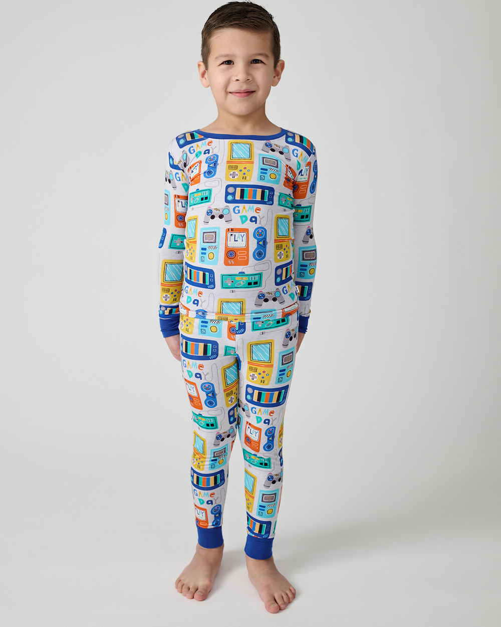 Standing boy wearing the Game On Two-Piece Pajama Set