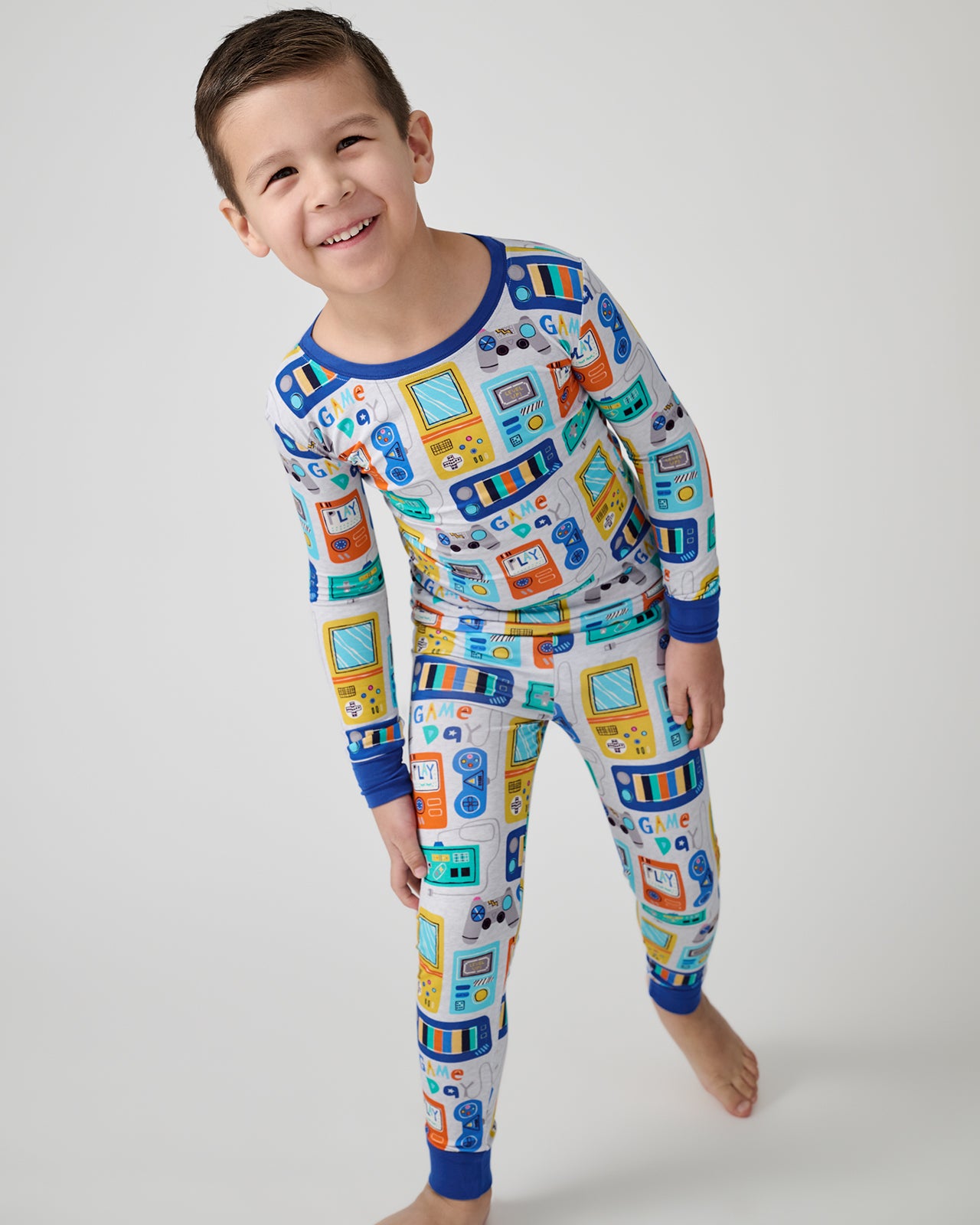 Walking child wearing the Game On Two-Piece Pajama Set