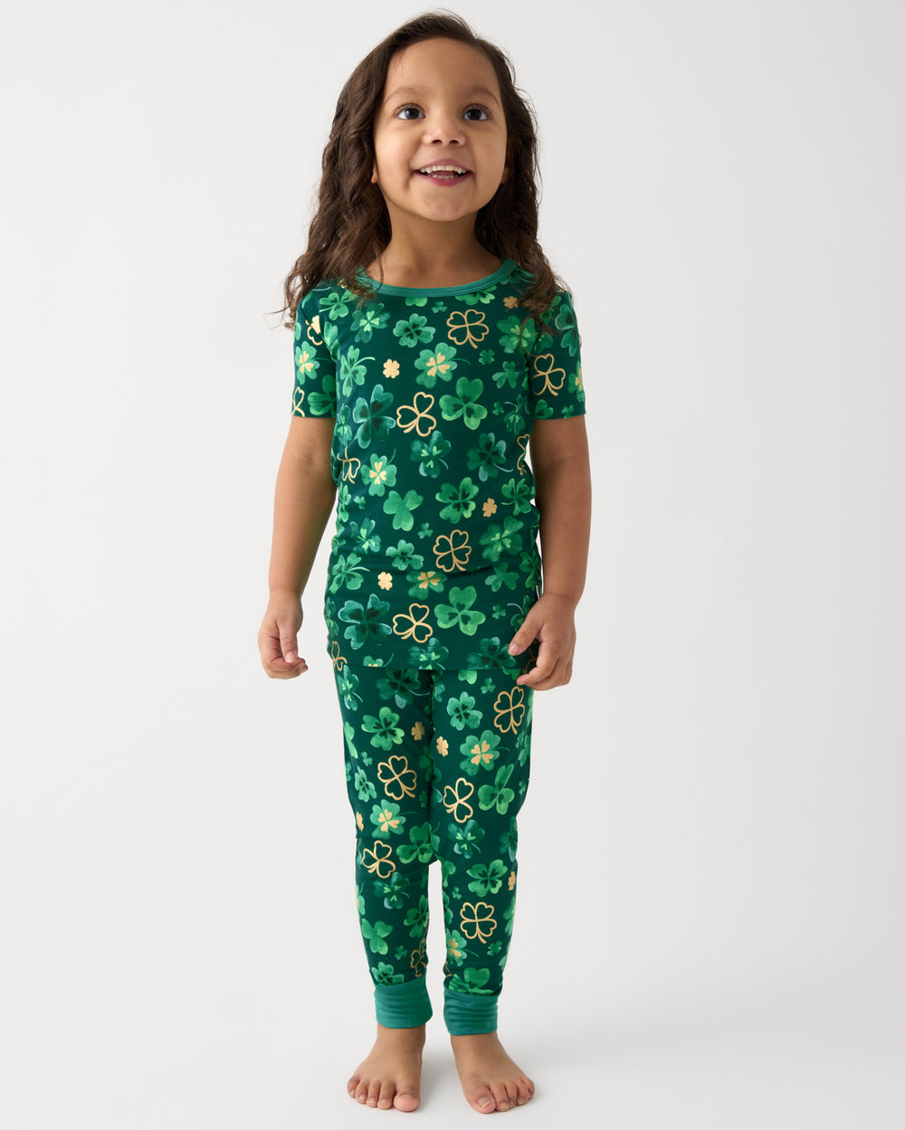Standing girl wearing the Clover Cuties Two-Piece Short Sleeve Pajama Set