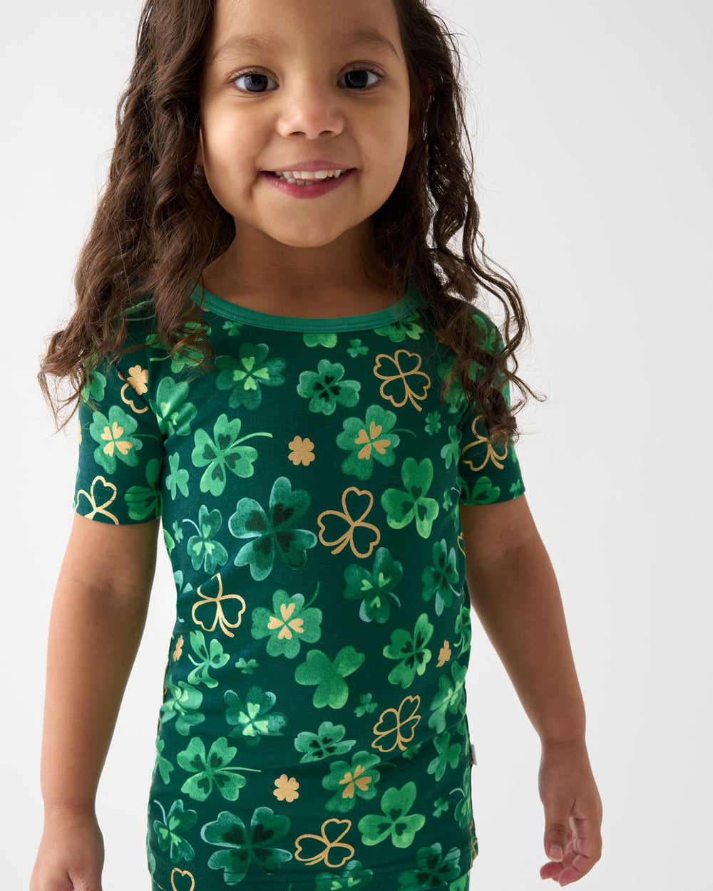 Close up of girl wearing the Clover Cuties Two-Piece Short Sleeve Pajama Set