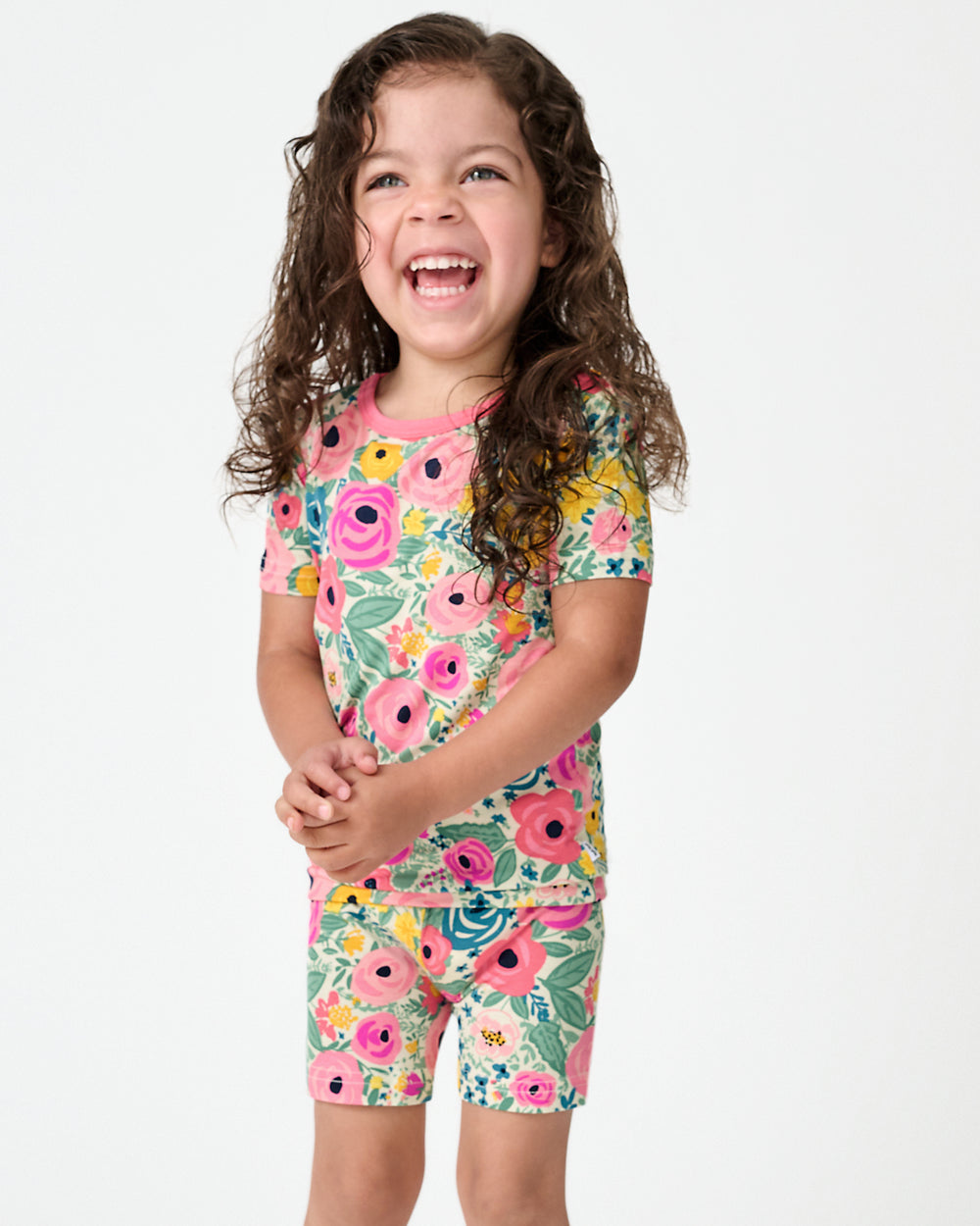 Close up of standing girl wearing the Secret Garden Two-Piece Short Sleeve & Shorts Pajama Set