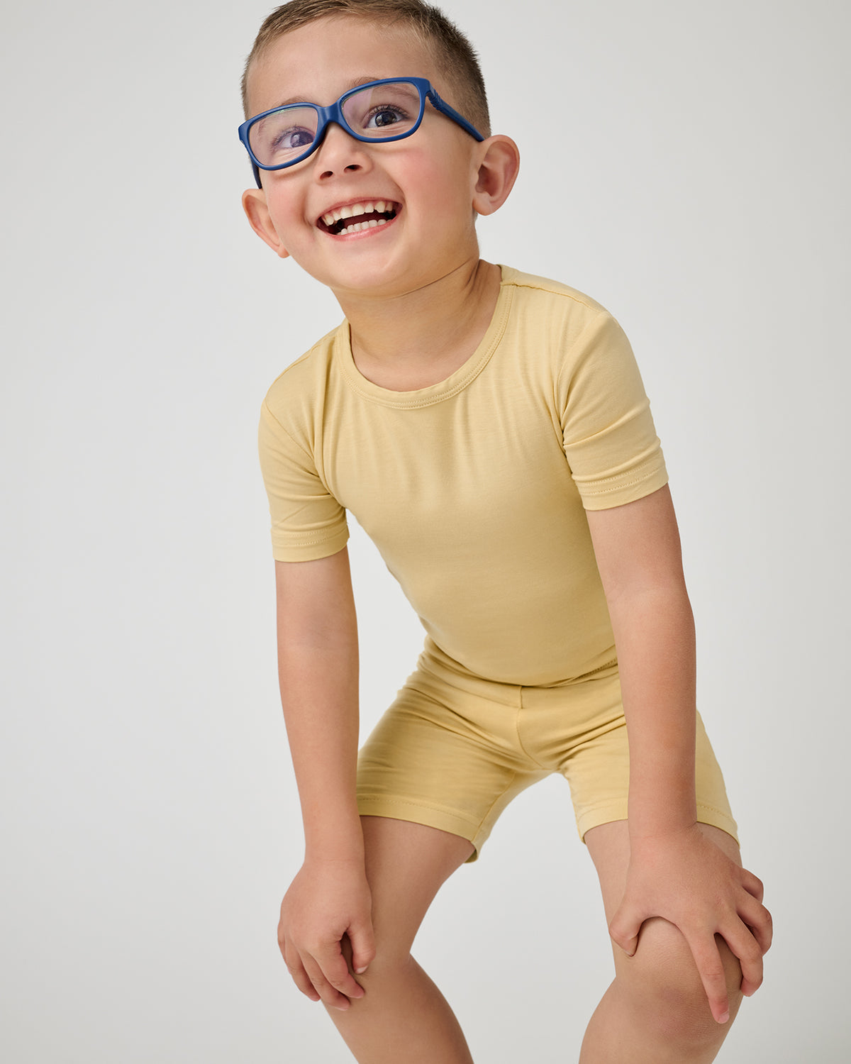 Close up of child wearing the Sunglow Two-Piece Short Sleeve & Shorts Pajama Set