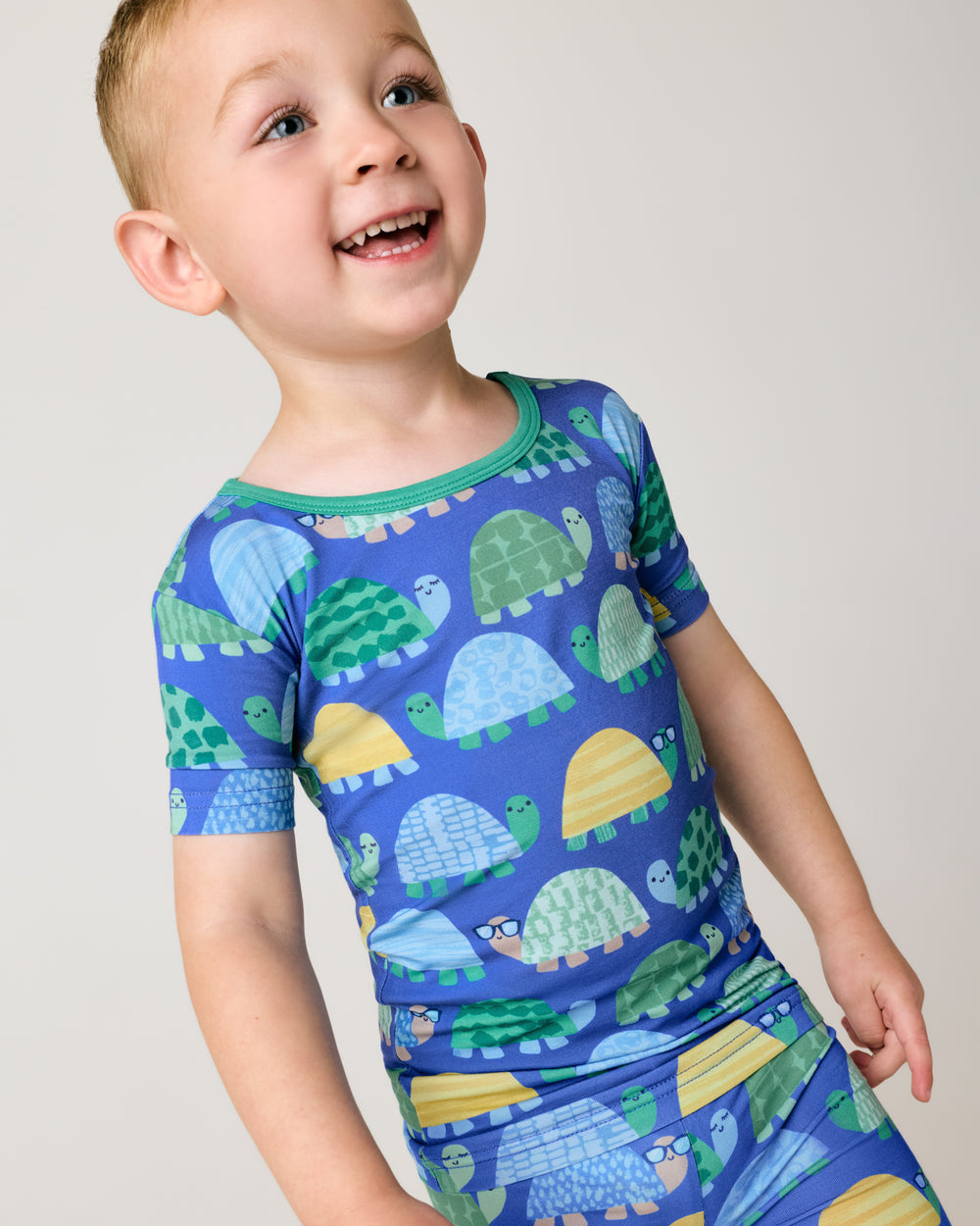 Alternate close up of boy wearing the Shell Parade Two-Piece Short Sleeve & Shorts Pajama Set